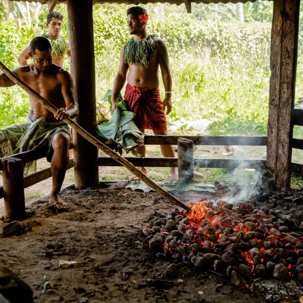 Traditional Samoan cooking over an earth oven
